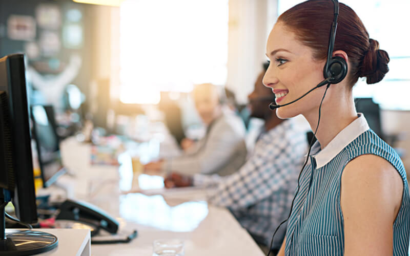 Smiling customer service representative with headset