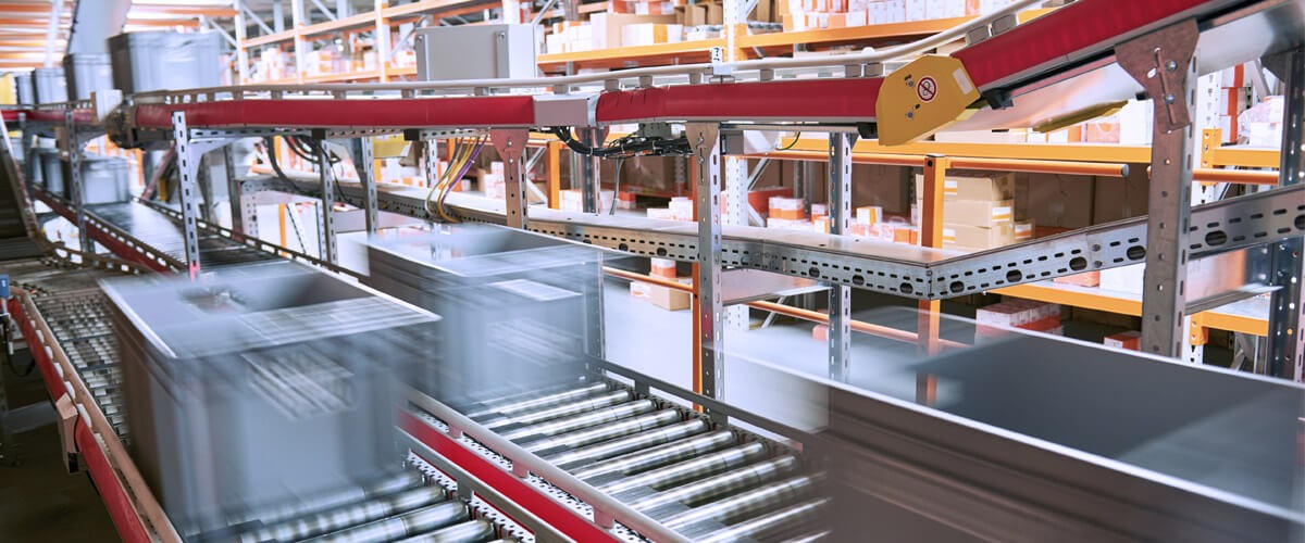 boxes moving through automated supply chain in factory