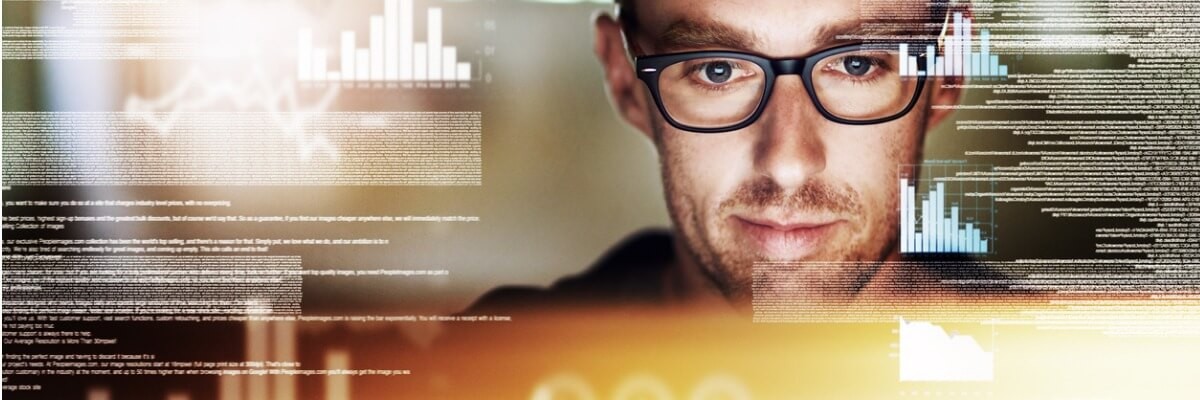Business professionals using laptops in a modern office meeting