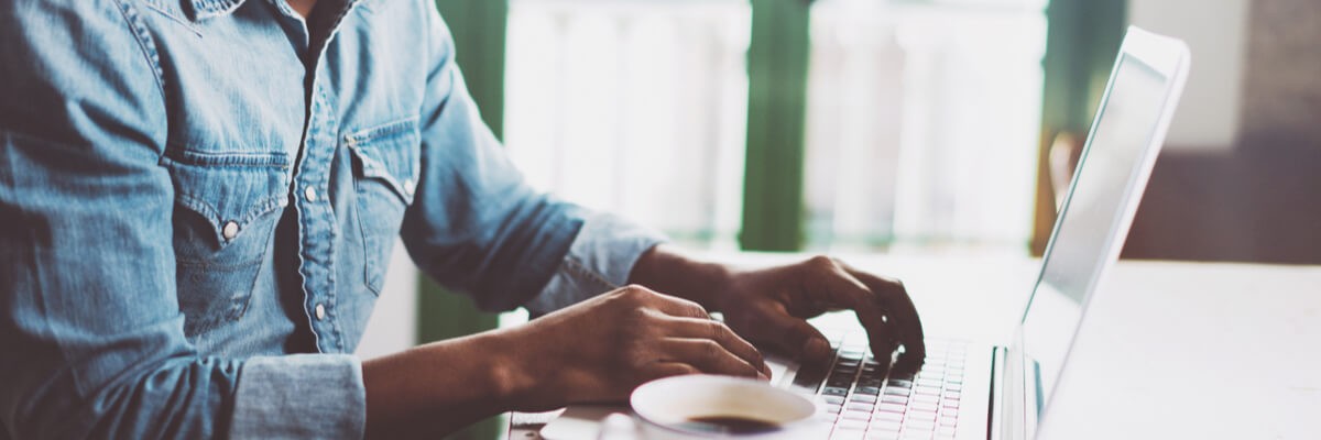 Man working on laptop remote