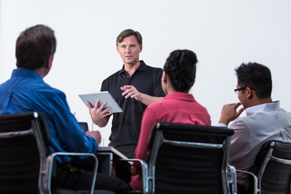 team-business-meeting-tablet-close-up