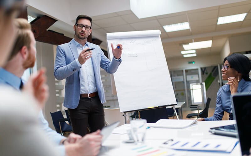 Lead designer presents in strategy workshop