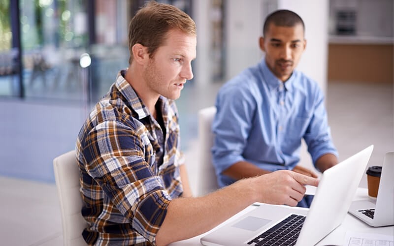 Business man viewing items in the online marketplace on computer