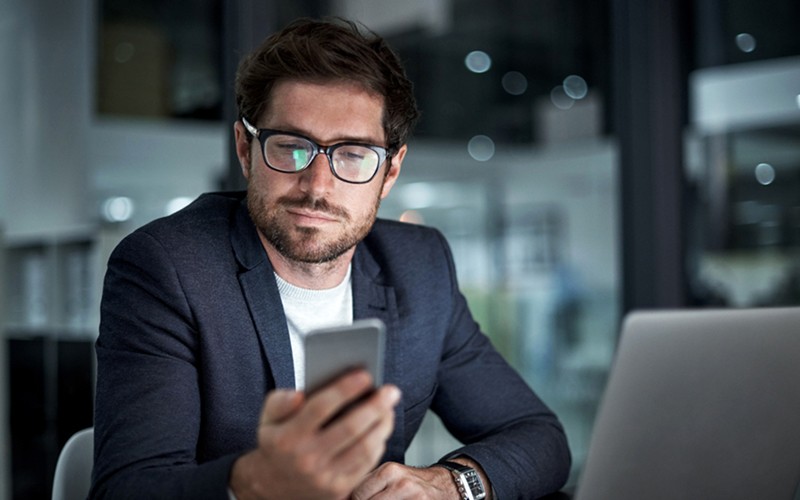 Business man viewing items in the online marketplace on computer